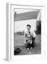 Father and Son Pull a Wagon in Backyard, Ca. 1946-null-Framed Photographic Print