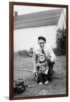 Father and Son Pull a Wagon in Backyard, Ca. 1946-null-Framed Photographic Print