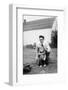 Father and Son Pull a Wagon in Backyard, Ca. 1946-null-Framed Photographic Print