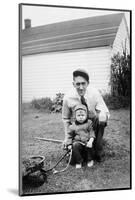 Father and Son Pull a Wagon in Backyard, Ca. 1946-null-Mounted Photographic Print