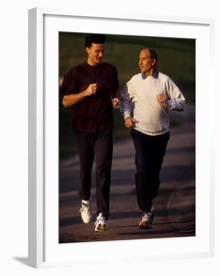 Father and Son Running Togerther for Exercise, New York, New York, USA-Paul Sutton-Framed Photographic Print