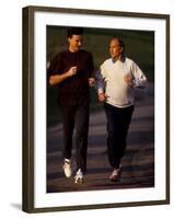 Father and Son Running Togerther for Exercise, New York, New York, USA-Paul Sutton-Framed Photographic Print