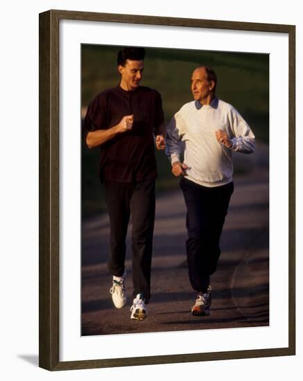 Father and Son Running Togerther for Exercise, New York, New York, USA-Paul Sutton-Framed Photographic Print