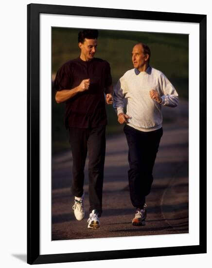 Father and Son Running Togerther for Exercise, New York, New York, USA-Paul Sutton-Framed Photographic Print