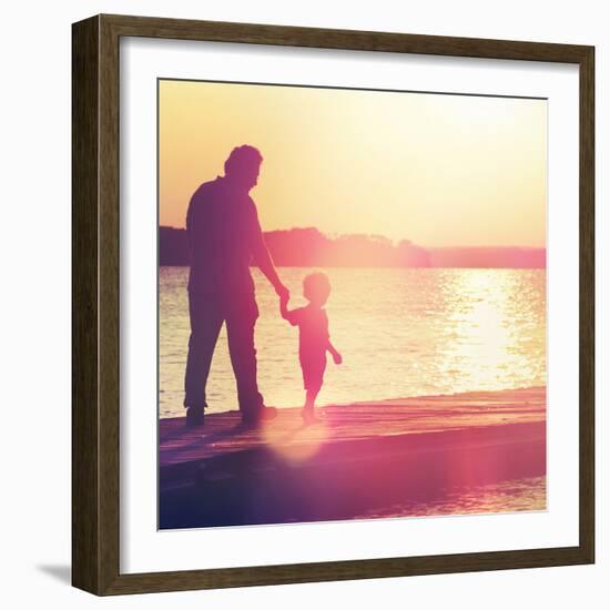 Father and Son Walking Out on a Dock at Sunset-soupstock-Framed Photographic Print