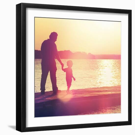 Father and Son Walking Out on a Dock at Sunset-soupstock-Framed Photographic Print