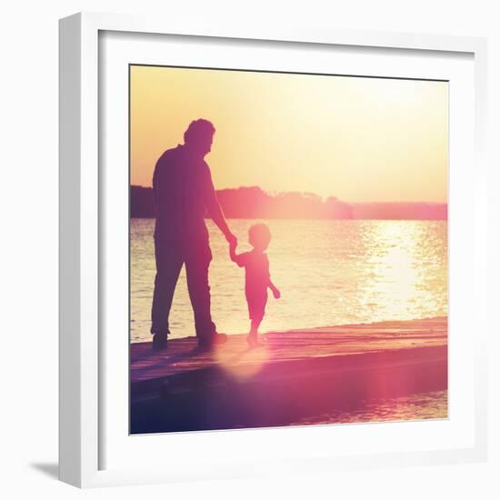 Father and Son Walking Out on a Dock at Sunset-soupstock-Framed Photographic Print