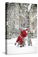 Father Christmas in Snow Behind Tree-null-Stretched Canvas