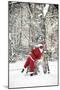 Father Christmas in Snow Behind Tree-null-Mounted Photographic Print