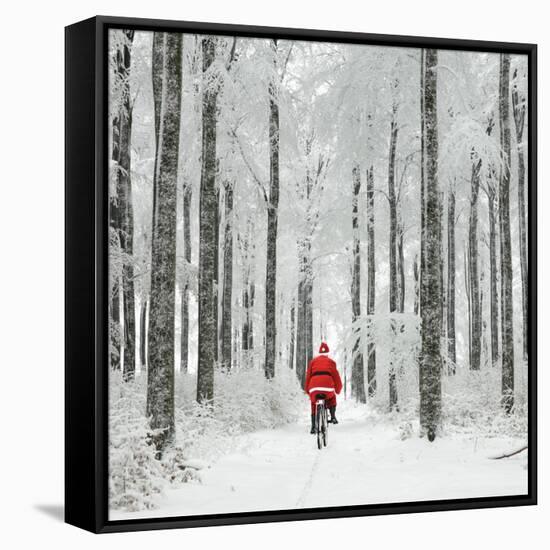 Father Christmas on a Bicycle in Snow-null-Framed Stretched Canvas