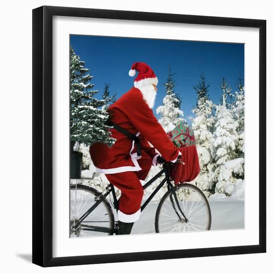 Father Christmas on Bicycle Cycling Past Fir-Ake Lindau and Johan De Meester-Framed Photographic Print