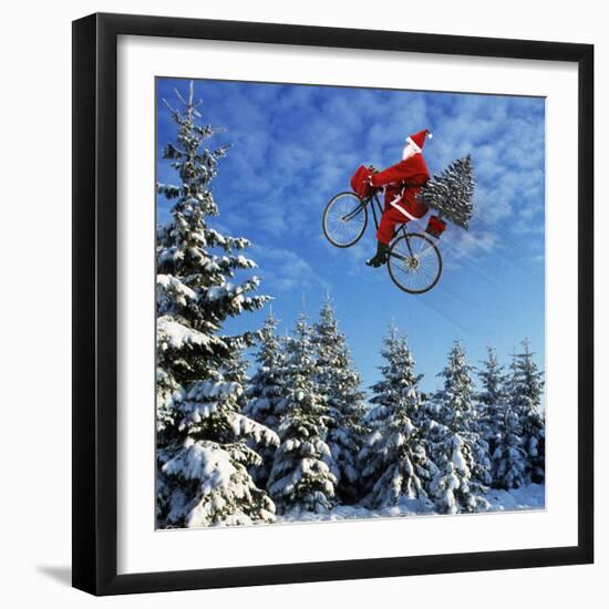 Father Christmas on Bicycle Flying Through the Air-null-Framed Photographic Print