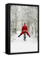 Father Christmas Riding Bicycle in Snowy Woodland Path-null-Framed Stretched Canvas