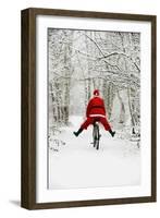 Father Christmas Riding Bicycle in Snowy Woodland Path-null-Framed Photographic Print