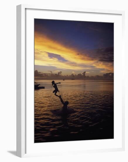 Father Playfully Throwing Son in Water-Barry Winiker-Framed Premium Photographic Print