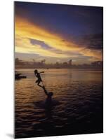 Father Playfully Throwing Son in Water-Barry Winiker-Mounted Photographic Print