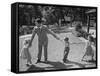 Father Playing in Yard with His Children-Wallace Kirkland-Framed Stretched Canvas