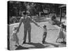 Father Playing in Yard with His Children-Wallace Kirkland-Stretched Canvas