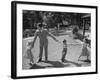 Father Playing in Yard with His Children-Wallace Kirkland-Framed Photographic Print