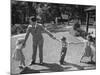 Father Playing in Yard with His Children-Wallace Kirkland-Mounted Photographic Print