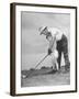 Father Teaching His Small Son How to Play Golf-null-Framed Photographic Print