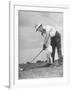 Father Teaching His Small Son How to Play Golf-null-Framed Photographic Print