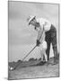 Father Teaching His Small Son How to Play Golf-null-Mounted Photographic Print