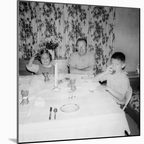 Father with Children at the Dinner Table, Ca. 1962-null-Mounted Photographic Print