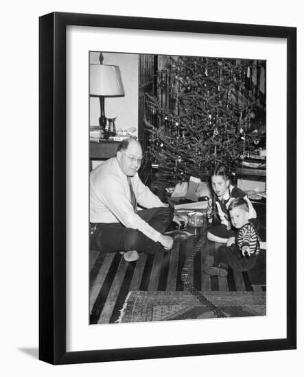 Father with Daughter and Son in Front of Christmas Tree, Ca. 1950-null-Framed Photographic Print