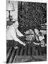 Father with Daughter and Son in Front of Christmas Tree, Ca. 1950-null-Mounted Photographic Print