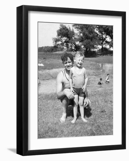 Father with Young Son at Water Hole, Ca. 1930-null-Framed Photographic Print