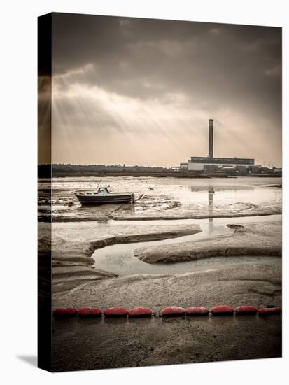 Fawley power station, a boat and a creek meandering through the mudflats all lit by a broken sky, H-Matthew Cattell-Stretched Canvas