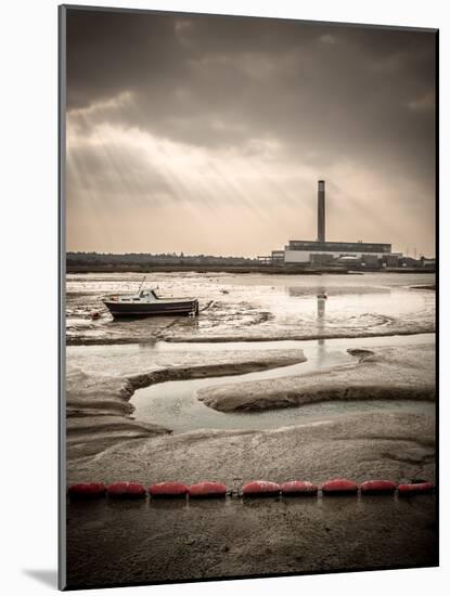 Fawley power station, a boat and a creek meandering through the mudflats all lit by a broken sky, H-Matthew Cattell-Mounted Photographic Print