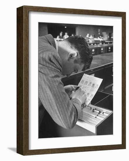 FBI Agent Examining Fingerprints-George Skadding-Framed Photographic Print