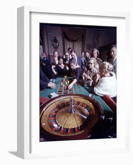 February 11, 1957: Tourists Gambling at the Nacional Hotel in Havana, Cuba-Ralph Morse-Framed Photographic Print