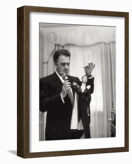 Federico Fellini and the Marionette, Rome 1960-Angelo Cozzi-Framed Photographic Print