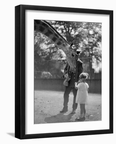 Feeding a Giraffe-null-Framed Photographic Print