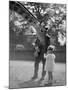 Feeding a Giraffe-null-Mounted Photographic Print