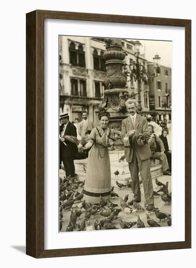 Feeding the Pigeons in the City Square-null-Framed Art Print