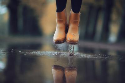 Feet in Rubber Boots Rain Puddle City Photographic Print | AllPosters.com