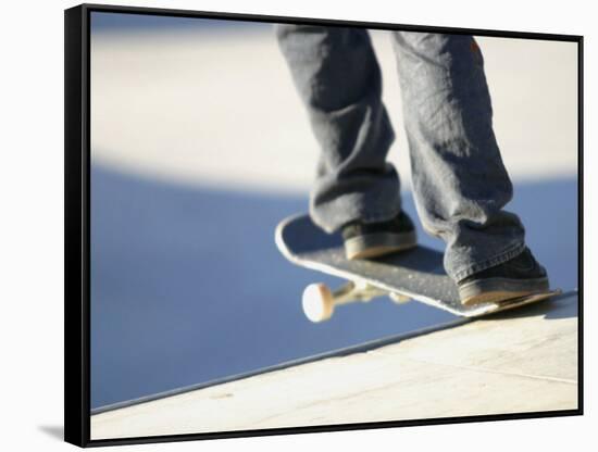 Feet on a Skateboard at the Edge of a Ramp-null-Framed Stretched Canvas