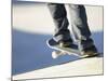 Feet on a Skateboard at the Edge of a Ramp-null-Mounted Photographic Print