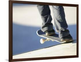 Feet on a Skateboard at the Edge of a Ramp-null-Framed Photographic Print