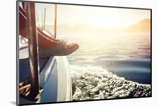 Feet on Boat Sailing at Sunrise Lifestyle-warrengoldswain-Mounted Photographic Print