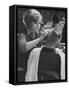 Female Barber Cutting a Customer's Hair in a Barber Shop-Ralph Crane-Framed Stretched Canvas
