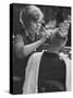 Female Barber Cutting a Customer's Hair in a Barber Shop-Ralph Crane-Stretched Canvas