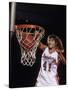 Female Basketball Player Dunking a Ball Through the Hoop-null-Stretched Canvas