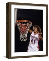 Female Basketball Player Dunking a Ball Through the Hoop-null-Framed Photographic Print