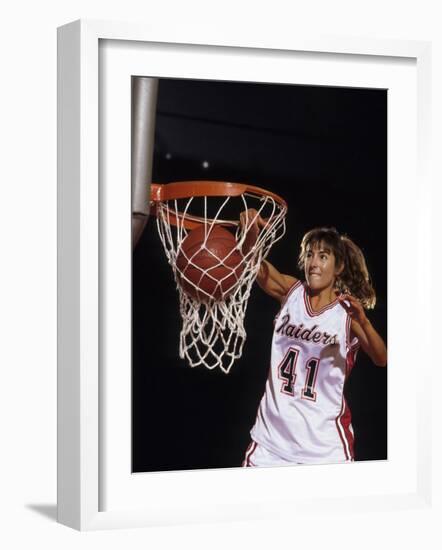 Female Basketball Player Dunking a Ball Through the Hoop-null-Framed Photographic Print