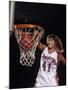 Female Basketball Player Dunking a Ball Through the Hoop-null-Mounted Photographic Print